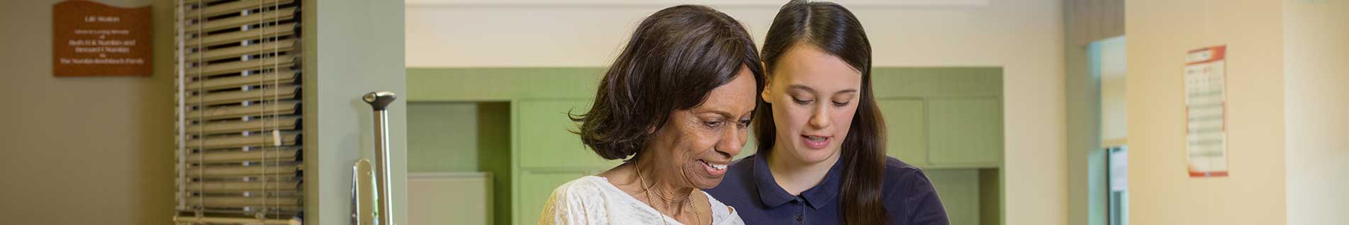 resident with a staff member
